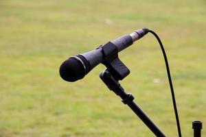 microphone ready to use on a celebration on a green grass background. photo