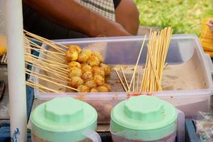 fried meatballs, grilled meatballs, fried sausages sold by street vendors photo