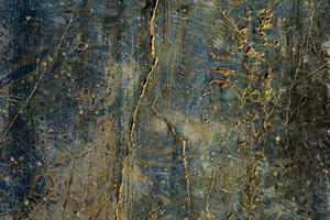 abstract grunge texture of a black wall with cracks, scratches and damages photo