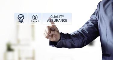 Quality Assurance Concept. Business people show high quality assurance mark, good service, premium, five stars, premium service assurance, excellence service, high quality, business excellence. photo