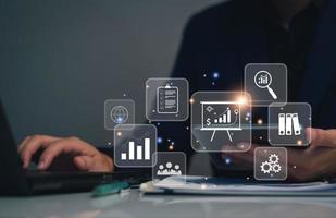 business management concept. development and management Executives looking virtual screens business management icons Goal setting, information, workflows, optimal business operations and innovation photo