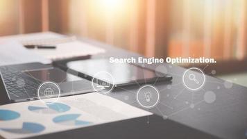 optimization analysis tools, search engine rankings, social media sites based on results analysis data,Marketing to increase people to website,laptop on desk, seo concept icon photo