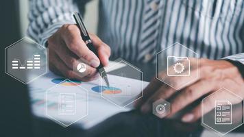 Businessmen review and analyze company documents and reports, fundraising concepts, business expansion investments, credit applications, Concept image of data gathering and statistical working. photo