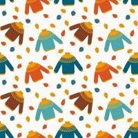 Autumnal seamless pattern with colorful sweater and leaves in flat style vector