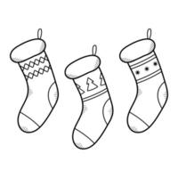 conjunto de calcetines navideños dibujados a mano. medias para regalos. ilustraciones vectoriales aisladas en estilo de dibujo de fideos. vector