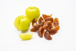 digestive dried amla candy with fresh Indian gooseberry photo