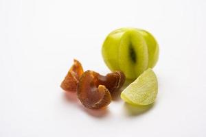 digestive dried amla candy with fresh Indian gooseberry photo