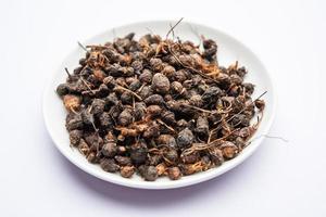 Ayurvedic Nagarmotha - Cyperus Scariosus or Cypriol in a bowl or heap photo
