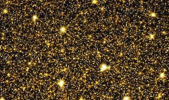 Gold glitter, gold particles star on black background. photo
