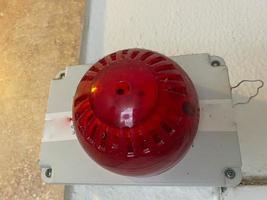 Large red plastic industrial fire alarm siren warning light for accident and disaster prevention and evacuation photo