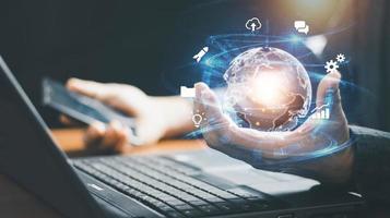 Hand holding virtual Global Internet connection metaverse. Business global internet connection application technology and digital marketing, Financial and banking, Digital link tech, big data. photo