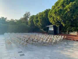 There are many chairs on the street for performances and public events in front of the open-air cinema concert stage photo