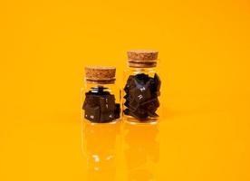 keyboard button in glass in jar in bucket on orange background photo