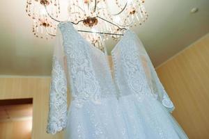 wedding dress in the room of the bride photo