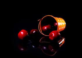 aluminum ice bucket laid in wait for use. stainless multi-colored bucket with red apples photo