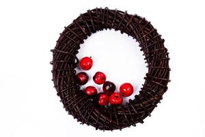 Wreath woven from the branches of the vine isolated , Place for text photo