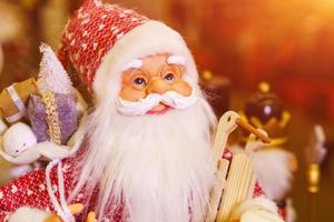 Souvenir doll of santa claus close up. Toy santa claus as a symbol of christmas photo