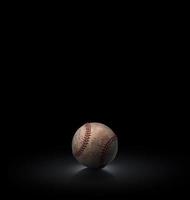 baseball ball on black background photo