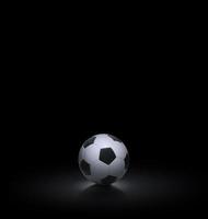 balón de fútbol sobre fondo negro foto
