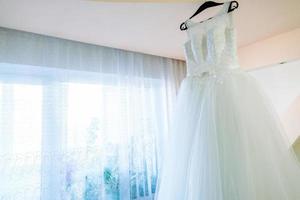 wedding dress in the room of the bride photo