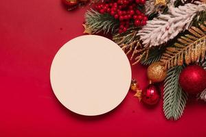 Mock up podium or pedestal for skincare beauty products and Christmas decorations top view on red background photo