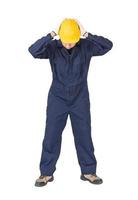 trabajador con overoles azules y casco en un uniforme con sendero recortado foto