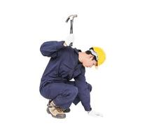 Handyman in uniform with his hammer photo