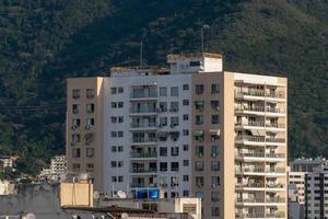 Rio, Brazil, July 15, 2022, view of apartment buildings in urban area with mountains in the background with greenery photo