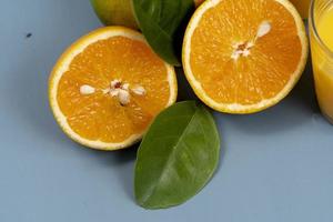 Natural orange juice in the glass with bottle on the side photo