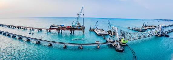 Pamban Bridge is a railway bridge that connects the town of Mandapam in mainland India with Pamban Island, and Rameswaram, Tamil Nadu, South India. it was India's first sea bridge. Cantilever bridge. photo