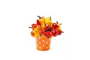 aluminum ice bucket laid in wait for use. stainless multi-colored bucket with red apples photo
