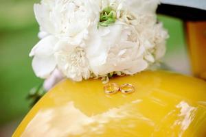 Two wedding rings on the floor with contrast photo