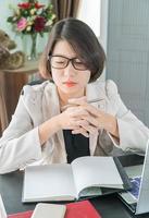 Teenage girl working on laptop in home office photo