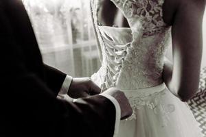 Bridal morning, bride wears dress. photo