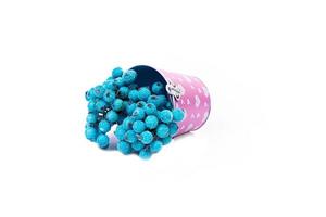 aluminum ice bucket laid in wait for use. stainless multi-colored bucket with red apples with white green blue berries in ice photo
