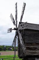 Summer landscape with an old wooden mill photo