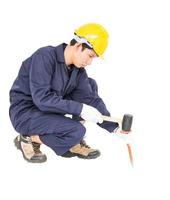 Man hold hammer and cold chisel on white photo