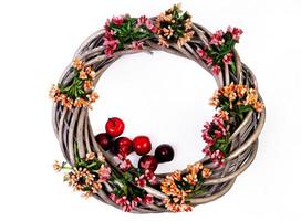 Wreath woven from the branches of the vine isolated , Place for text photo