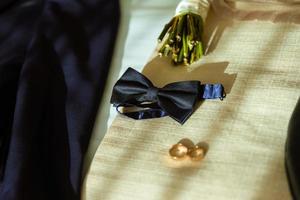 The groom's fees, jacket and watch photo