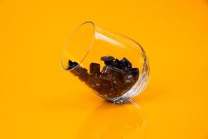 keyboard button in glass in jar in bucket on orange background photo