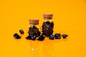 keyboard button in glass in jar in bucket on orange background photo