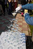 many wedding glasses with sparkling wine in restaurant photo