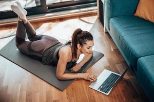 Woman Doing Online Workout At Home photo