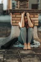 Woman Feeling Depression While Sitting And Preparing For Outdoors Training photo