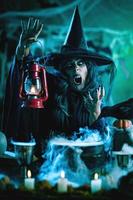 Witch With Lantern In Magic Fog photo