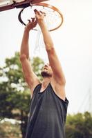 Installation Of Basketball Net On The Hoop photo