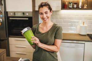 Woman Making A Healthy Smoothie At Home photo