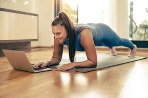 Woman Doing Online Workout At Home photo