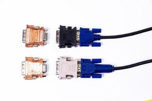 various converter cables adapters for computers and smartphones HDMI VGA USB DVI DP isolated on white photo