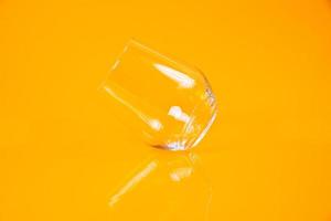 empty glass empty jar empty ice bucket on orange background photo